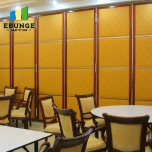 interior designer evaluating a sliding folding wall in a hotel banquet hall