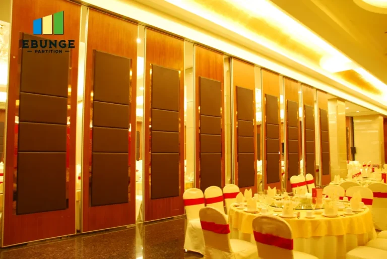 of operable wall dividing a school hall with acoustic panels
