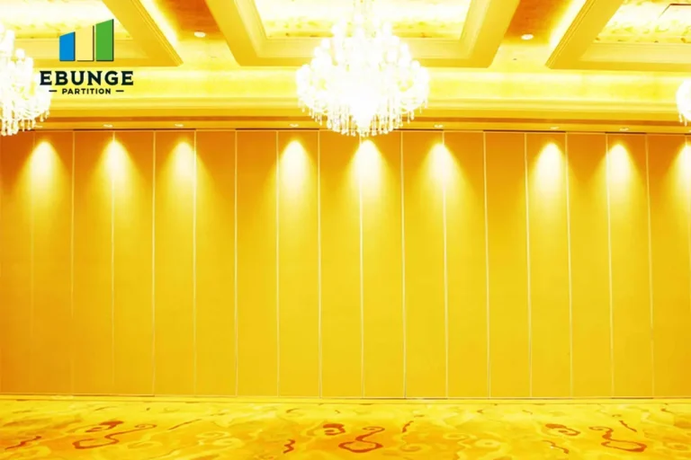 architect reviewing movable acoustic wall cost factors for school hall