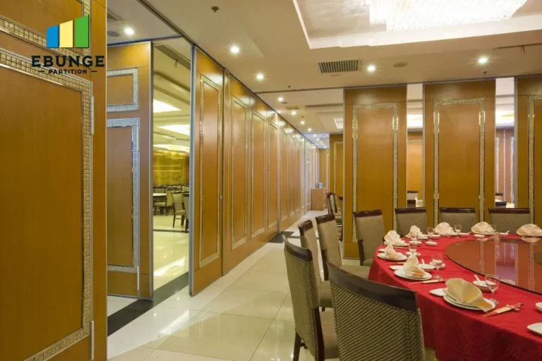 engineer checking sliding partition track specification for hotel banquet hall