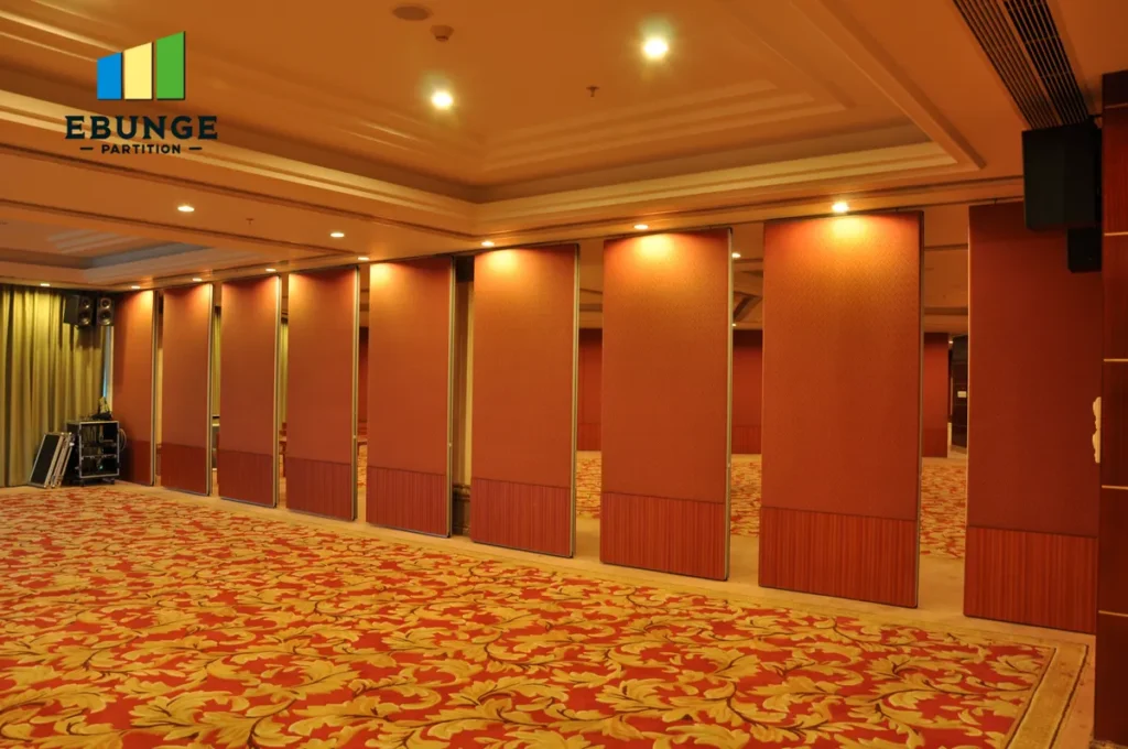 movable partition wall track system in a community center