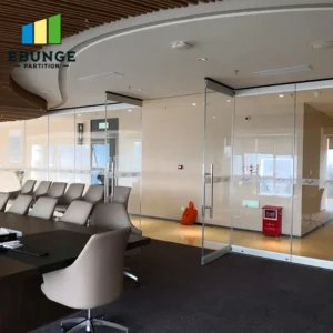 glass sliding partitions in an office meeting room with acoustic panels