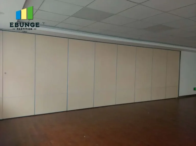 of a movable partition wall dividing a training room into two spaces
