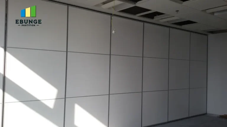 close-up of acoustic seals and a top-hung track system on a movable partition wall.