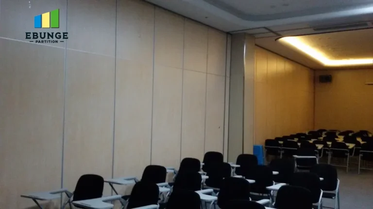 sliding partitions for rooms in a school hall with acoustic panels