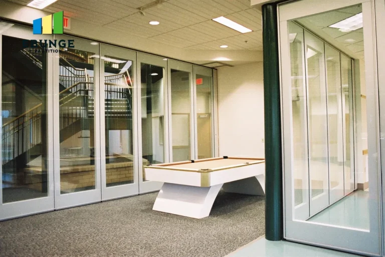 engineer reviewing movable partition wall drawings on desk