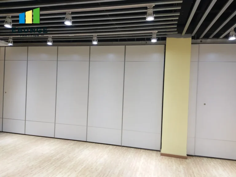 contractor assessing movable partition structural coordination in exhibition hall