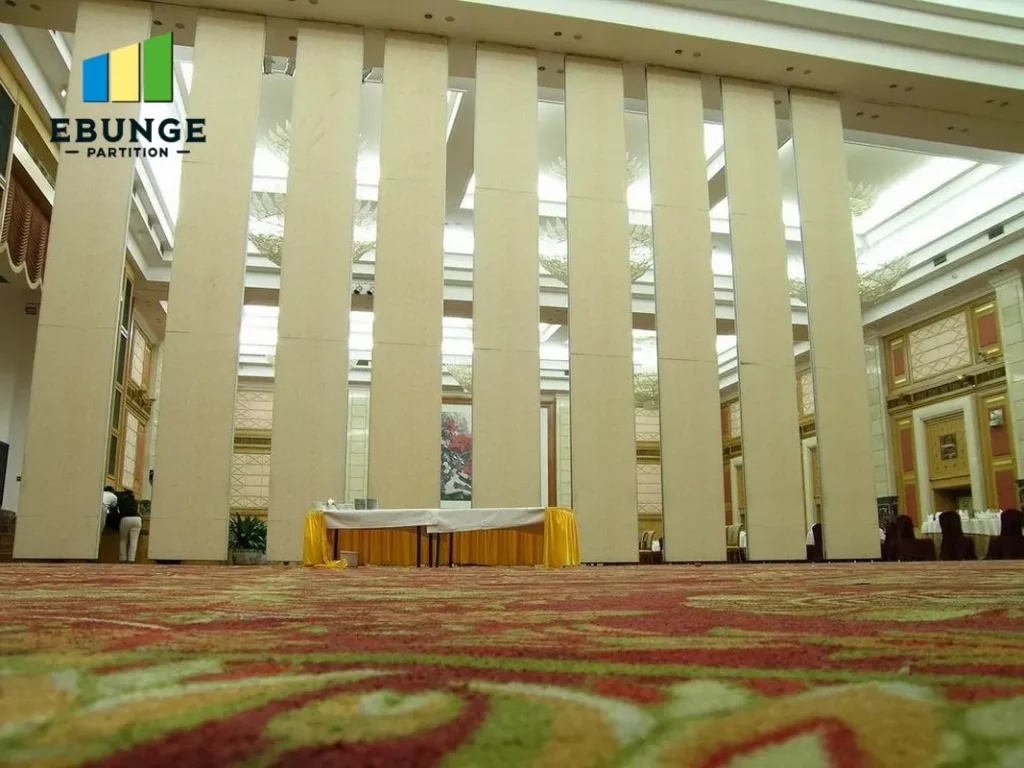 architect reviewing movable partition stacking layout in office meeting room
