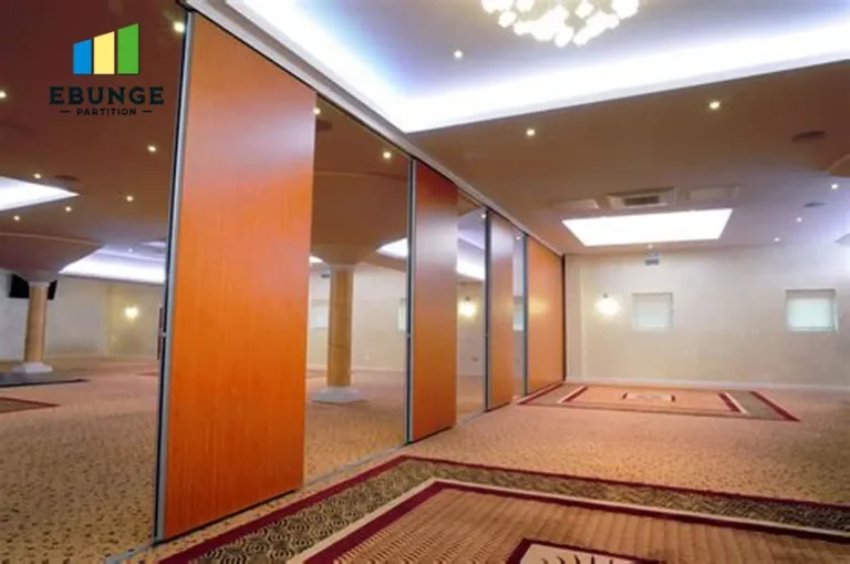 folding partition room divider in a school hall with acoustic panels