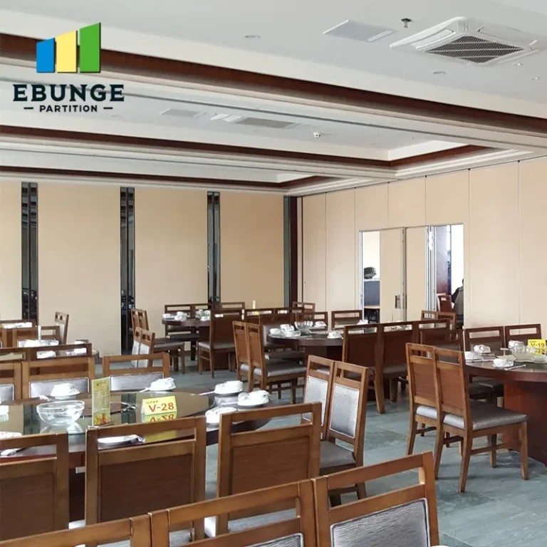 folding partition room divider in a school hall with acoustic panels