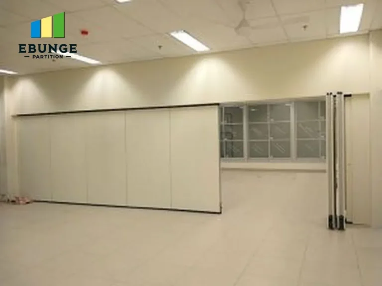 school hall with movable partition wall in wood finish, showing acoustic performance