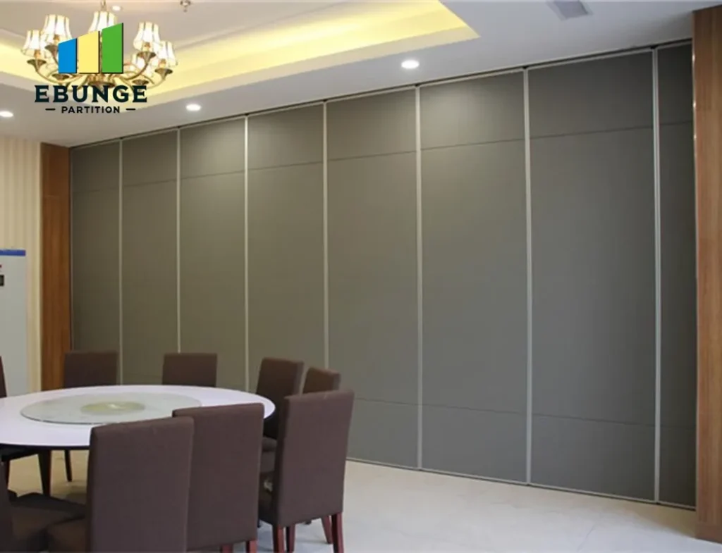 movable partition wall panels stacked neatly in a school hall