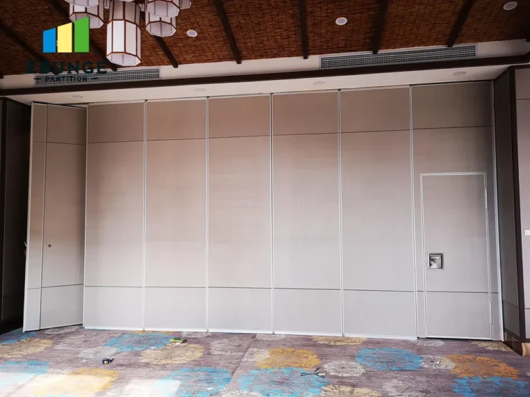 folding partitions stacked against wall to open up space