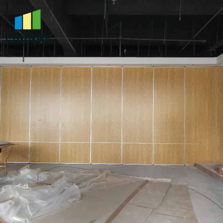 movable partition wall panels stacked in a school hall