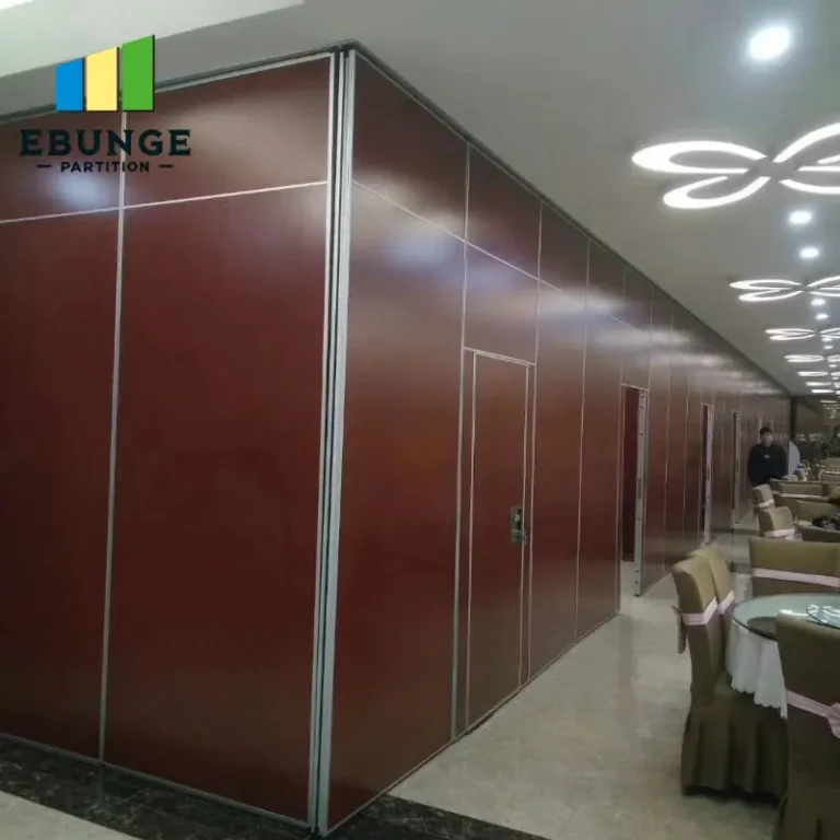 engineer inspecting movable partition ceiling support track in community center