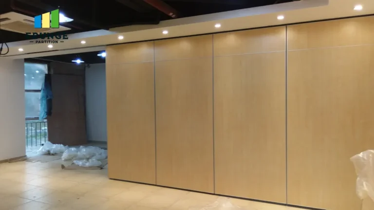 engineer assessing movable partition ceiling support in training center