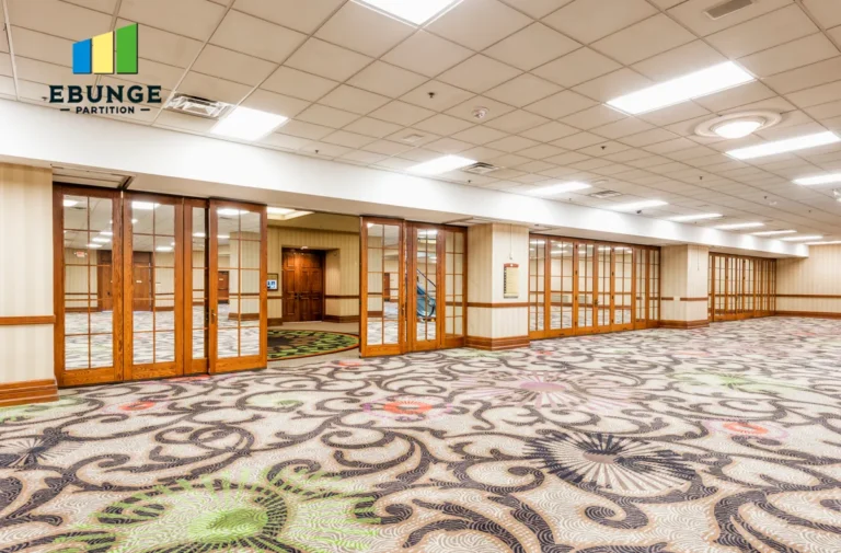 top hung partition system in a community center with acoustic panels