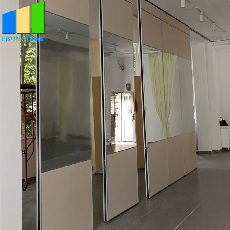 Partially opened glazed movable partition panels in a bright room