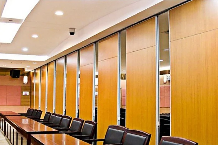 Movable partition wall panels at a conference centre stacking area