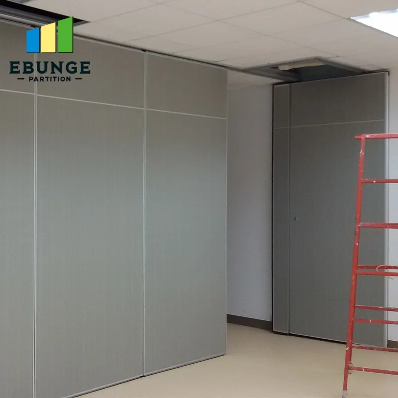 Movable partition panels below a ceiling grid at an opening