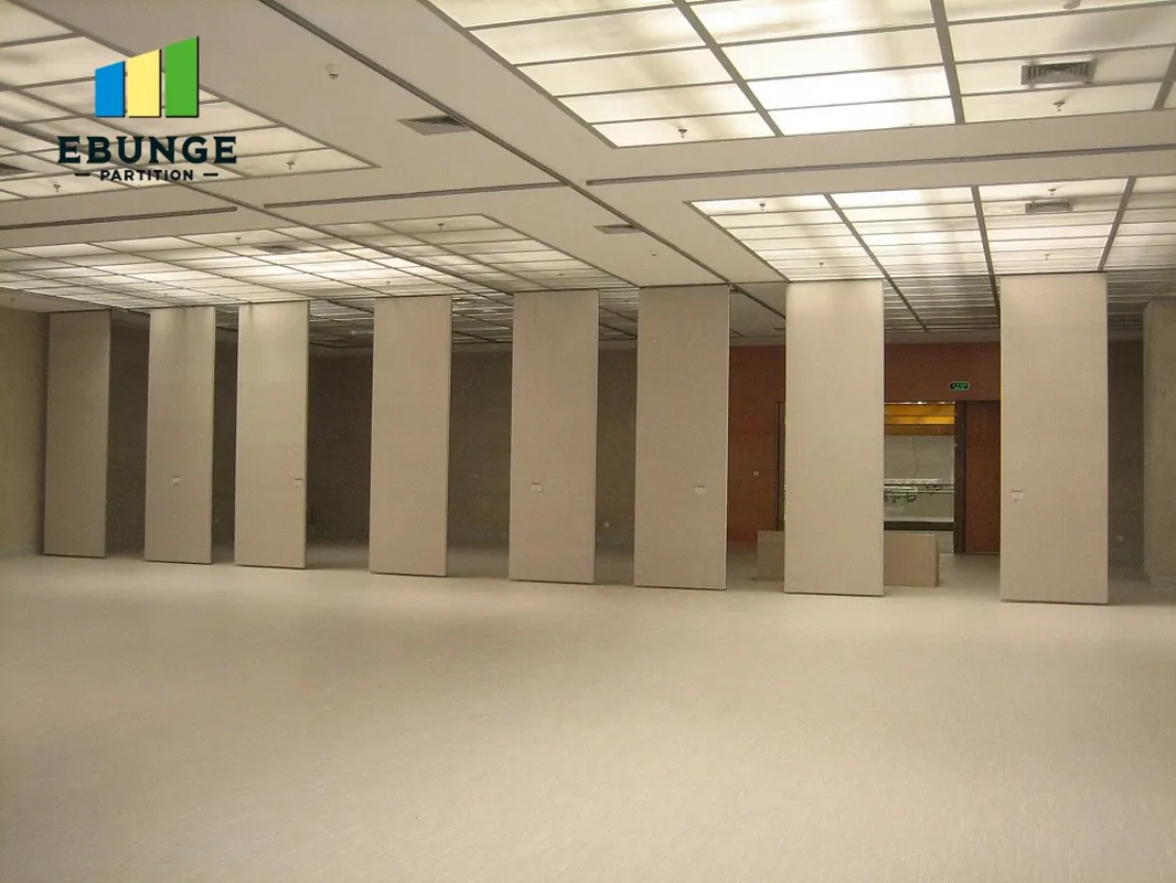 Movable partition panels spaced across an open room