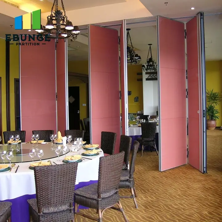 Partly open pink operable wall panels with room circulation beside them