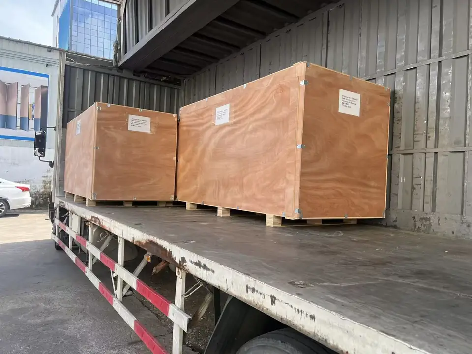 Two wooden shipping crates loaded on a truck bed