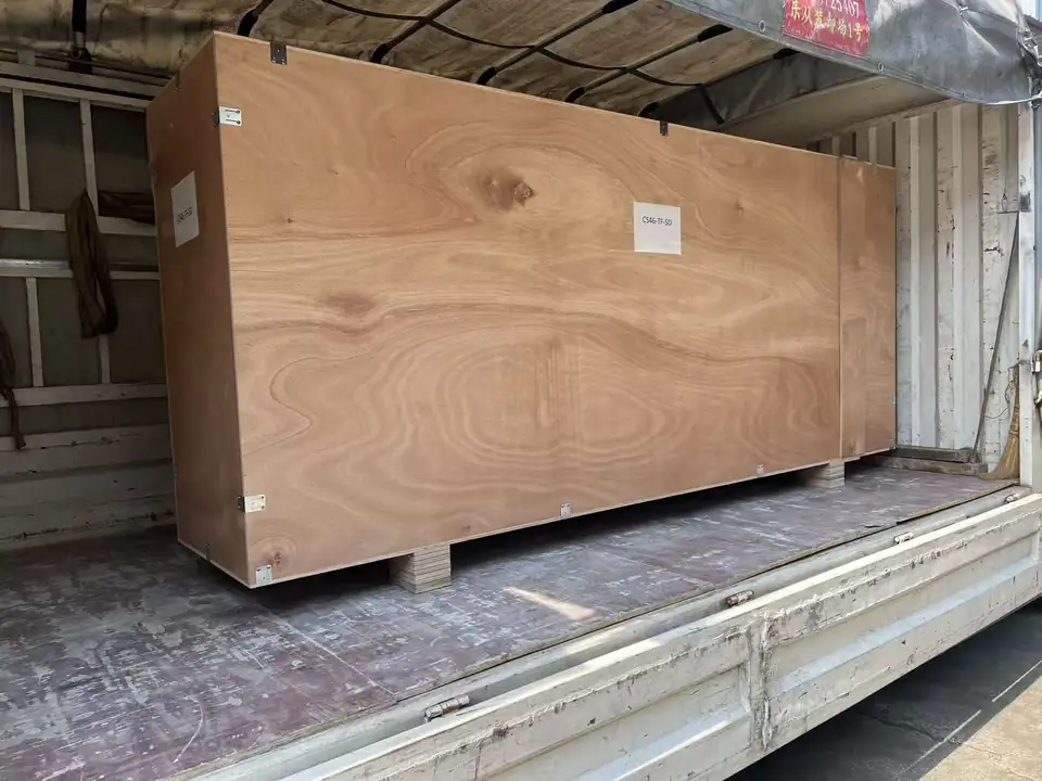 Long wooden transport crate inside a truck