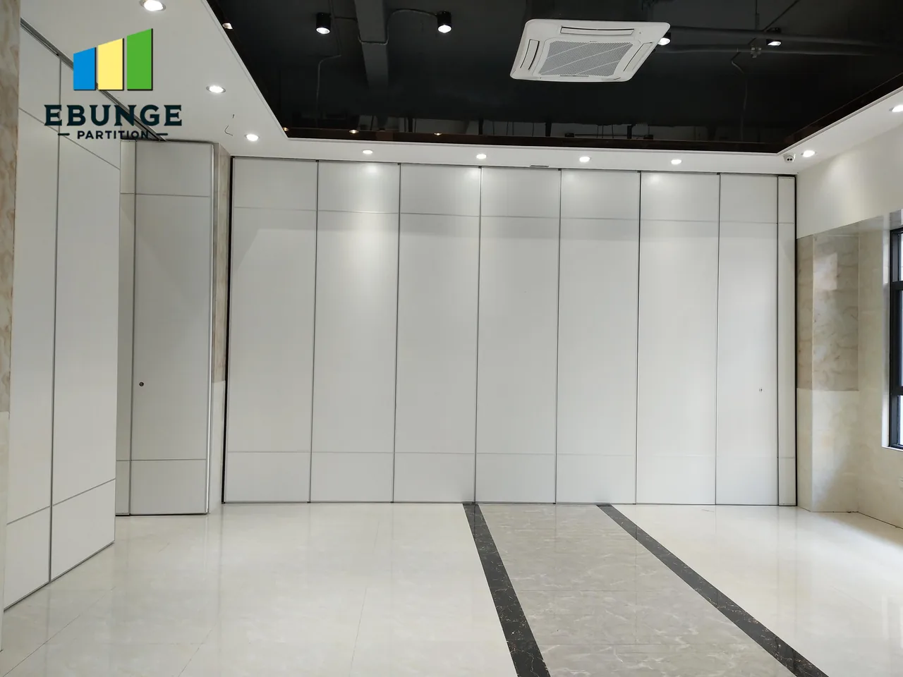 Real gray movable partition above a patterned tile floor in a finished room