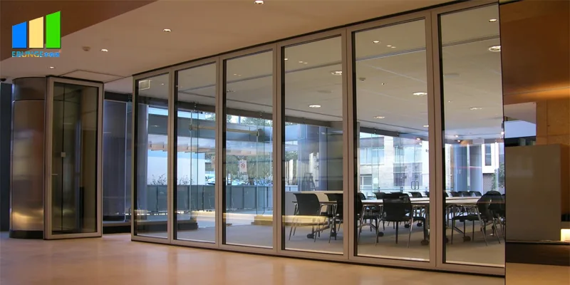 Real full-height glass partition in an office, shown as a separate glass-system alternative