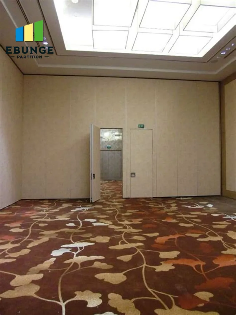 Real carpeted room with a partition-side door opening in the background