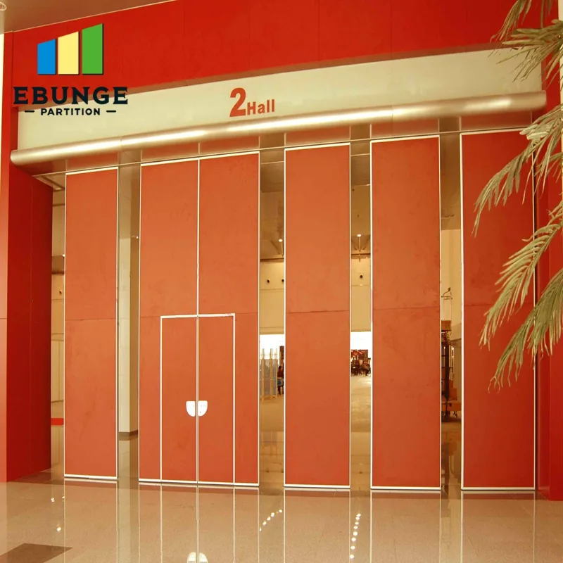Real orange movable partition panels with visible door leaves in an event hall